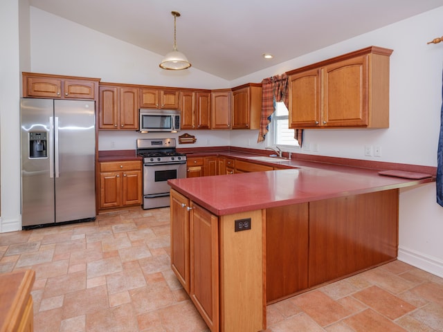 6273 S 12th St, Portage, MI 49024 - kitchen featuring brown cabinetry, stone finish flooring, appliances with stainless steel finishes, vaulted ceiling, and a sink