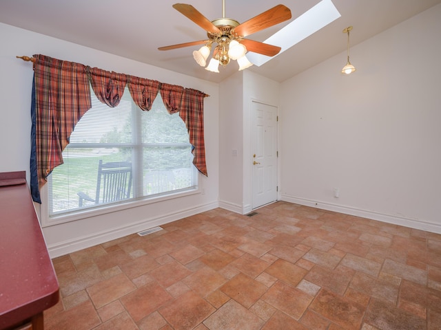 6273 S 12th St, Portage, MI 49024 - empty room featuring visible vents, baseboards, a ceiling fan, stone finish flooring, and a skylight