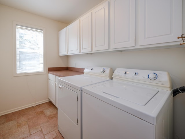 6273 S 12th St, Portage, MI 49024 - laundry room featuring cabinet space, separate washer and dryer, baseboards, and stone finish floor