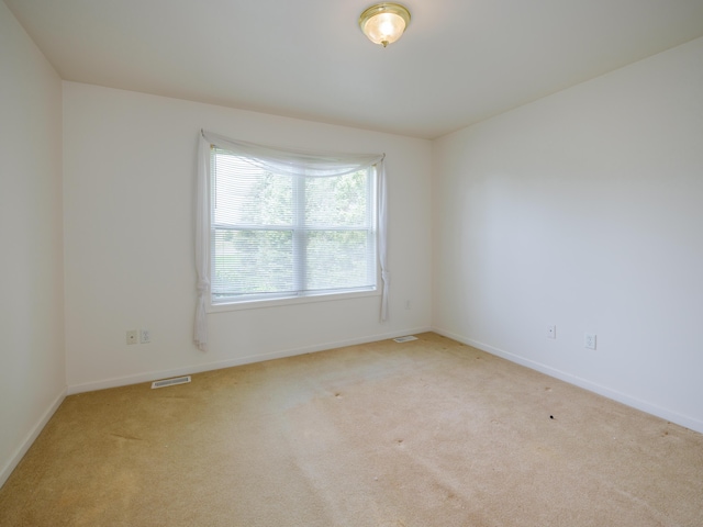 6273 S 12th St, Portage, MI 49024 - unfurnished room featuring visible vents, baseboards, and light colored carpet