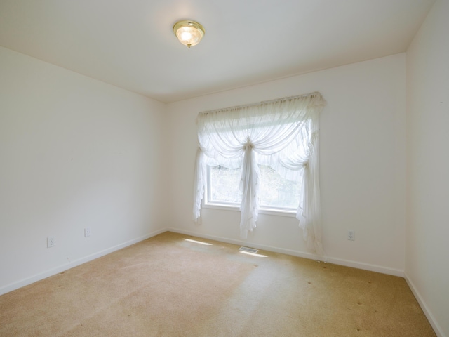6273 S 12th St, Portage, MI 49024 - unfurnished room with baseboards, light colored carpet, and visible vents
