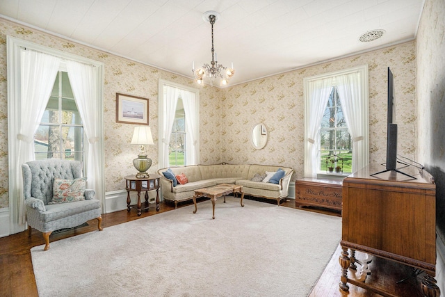 204 E Burr Oak St, Centreville, MI 49032 - living room with a wealth of natural light, a notable chandelier, wood finished floors, and wallpapered walls