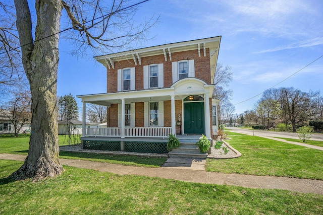 204 E Burr Oak St, Centreville, MI 49032 - italianate-style house featuring brick siding, a front lawn, and covered porch