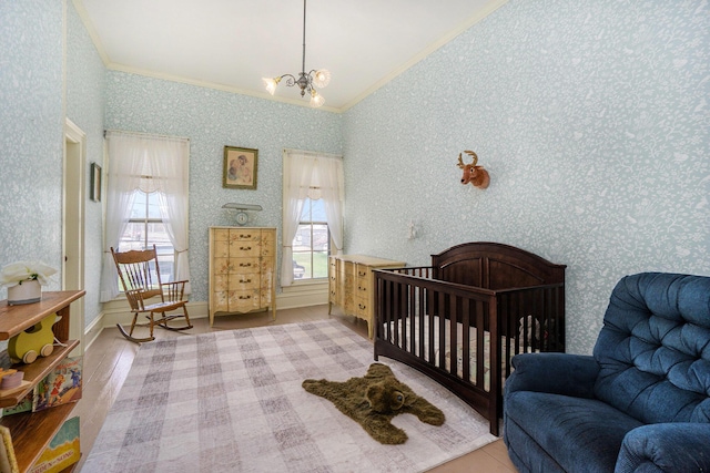 204 E Burr Oak St, Centreville, MI 49032 - bedroom with an inviting chandelier, ornamental molding, wallpapered walls, and light wood-type flooring