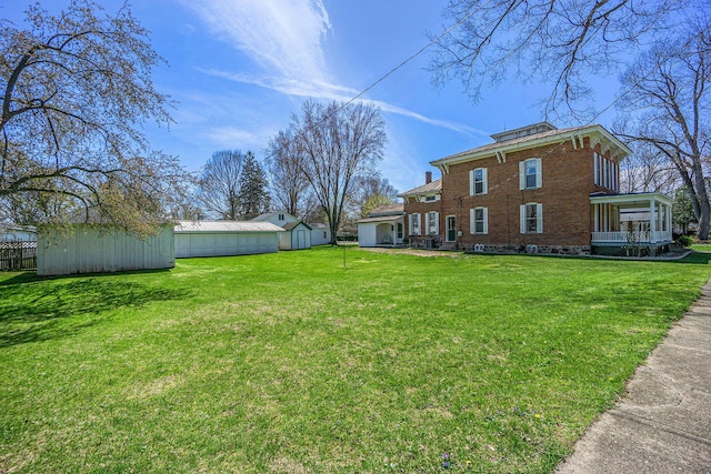 204 E Burr Oak St, Centreville, MI 49032 - view of yard featuring an outdoor structure and a storage unit