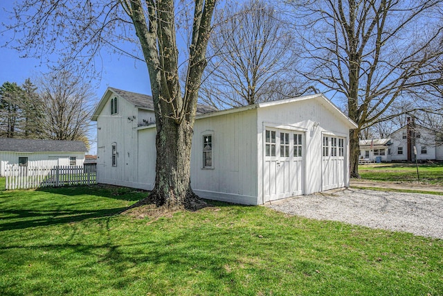 204 E Burr Oak St, Centreville, MI 49032 - garage with fence