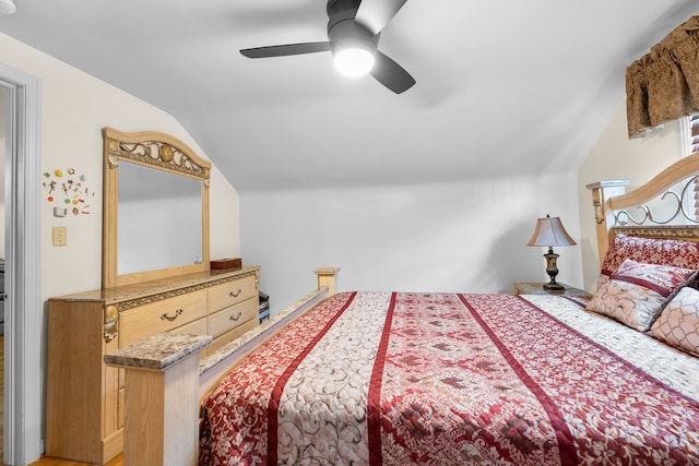 bedroom featuring lofted ceiling and a ceiling fan