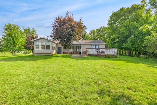 2316 Sugar Riv, Gladwin, MI 48624 - back of property featuring a wooden deck and a yard