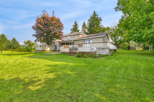 2316 Sugar Riv, Gladwin, MI 48624 - back of house with a yard, a wooden deck, and a sunroom
