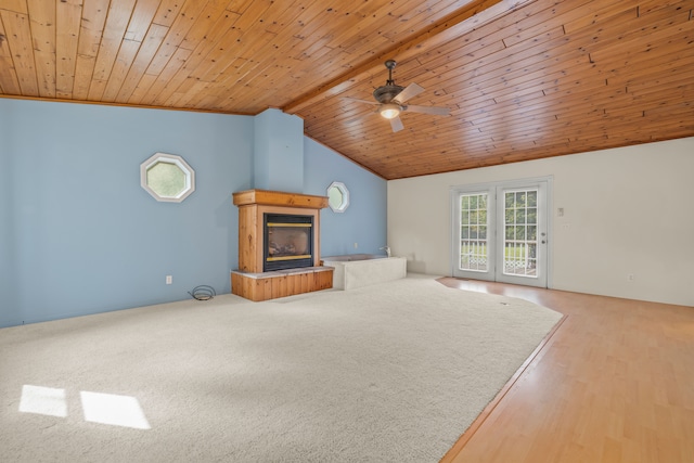 2316 Sugar Riv, Gladwin, MI 48624 - unfurnished living room featuring ceiling fan, a glass covered fireplace, wooden ceiling, wood finished floors, and vaulted ceiling