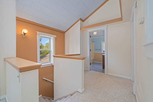 2316 Sugar Riv, Gladwin, MI 48624 - hall with ornamental molding, carpet, vaulted ceiling, and an upstairs landing