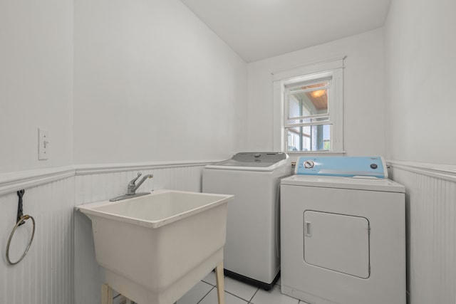 2316 Sugar Riv, Gladwin, MI 48624 - laundry room featuring laundry area, a sink, a wainscoted wall, light tile patterned floors, and washer and dryer