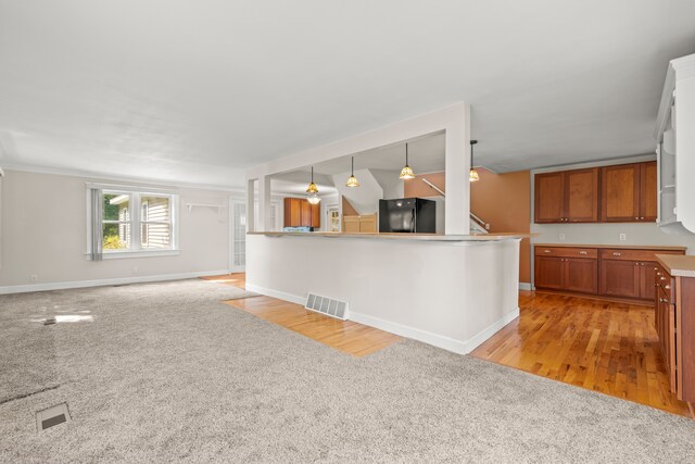 2316 Sugar Riv, Gladwin, MI 48624 - interior space with visible vents, stairs, light carpet, baseboards, and light wood-type flooring