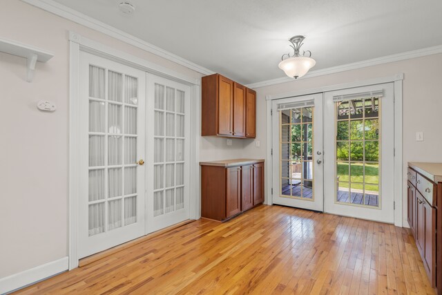 2316 Sugar Riv, Gladwin, MI 48624 - unfurnished dining area with crown molding, baseboards, french doors, and light wood-style floors