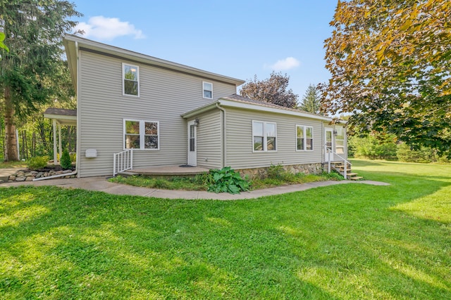 2316 Sugar Riv, Gladwin, MI 48624 - rear view of property featuring a yard