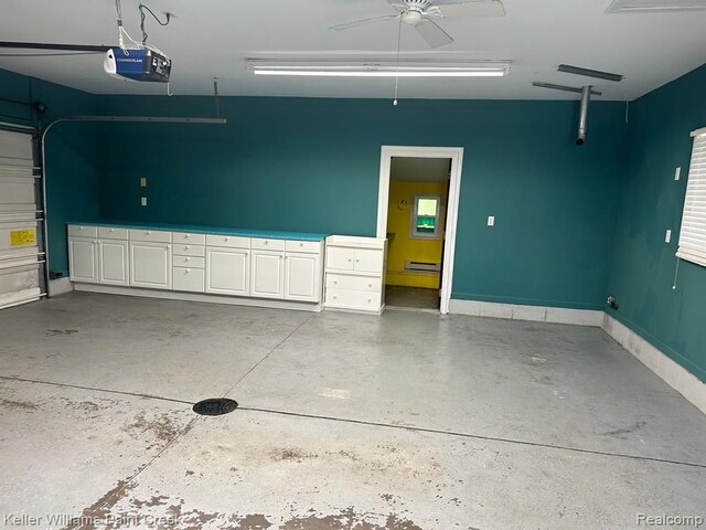 2316 Sugar Riv, Gladwin, MI 48624 - garage with ceiling fan and a garage door opener