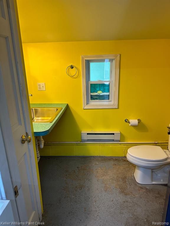 2316 Sugar Riv, Gladwin, MI 48624 - bathroom with a sink, a baseboard radiator, and toilet