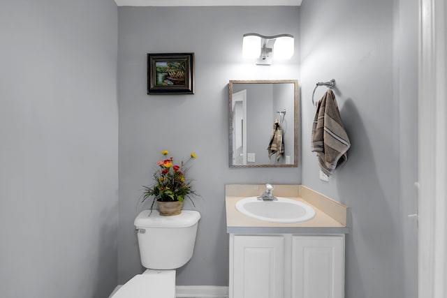 half bath with toilet and vanity