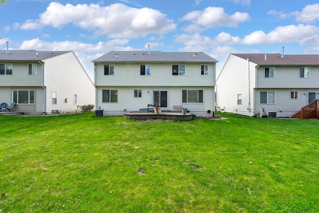 back of property featuring central air condition unit, a patio, and a yard