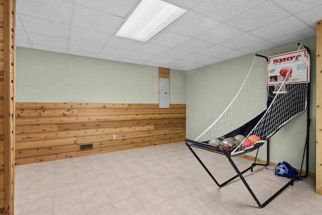 9681 Sugar Bush Run, Traverse City, MI 49685 - rec room with tile patterned floors, a drop ceiling, and visible vents