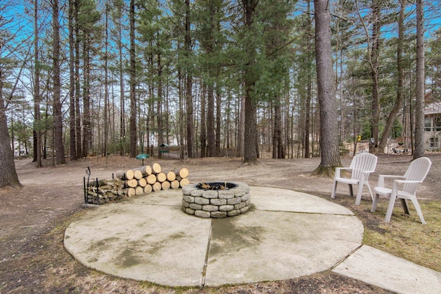 9681 Sugar Bush Run, Traverse City, MI 49685 - view of patio with an outdoor fire pit