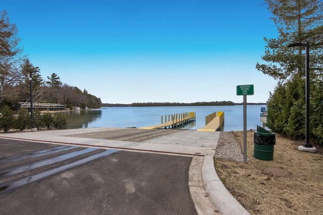 9681 Sugar Bush Run, Traverse City, MI 49685 - dock area featuring a water view