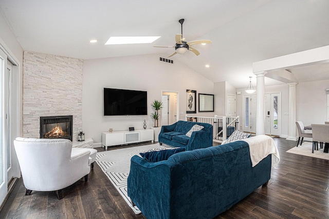 5591 Pioneer Ave, Saint Joseph, MI 49085 - living area with a ceiling fan, a skylight, a fireplace, dark wood-type flooring, and visible vents