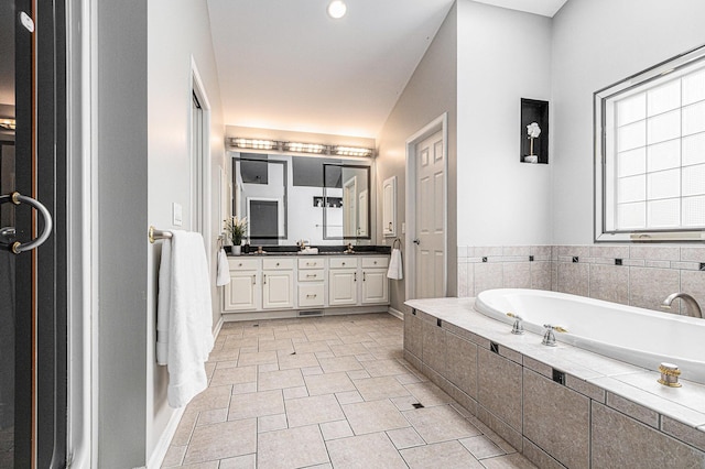 5591 Pioneer Ave, Saint Joseph, MI 49085 - bathroom featuring a bath, visible vents, and double vanity