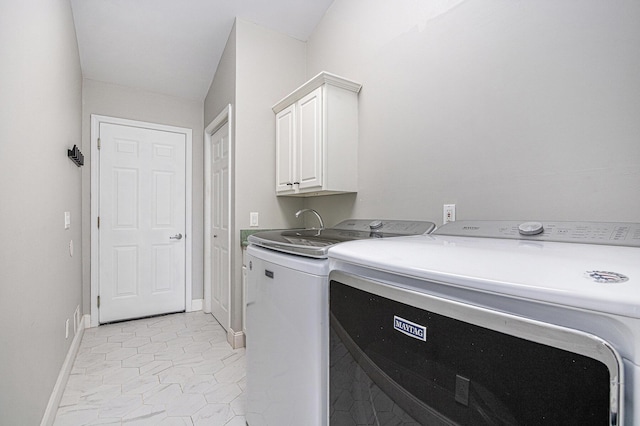 5591 Pioneer Ave, Saint Joseph, MI 49085 - laundry area with washer and dryer, baseboards, and cabinet space
