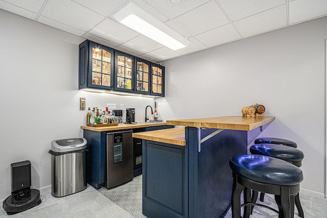 5591 Pioneer Ave, Saint Joseph, MI 49085 - bar featuring fridge, a drop ceiling, light colored carpet, and wet bar