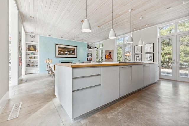 reception featuring a sink, visible vents, and french doors