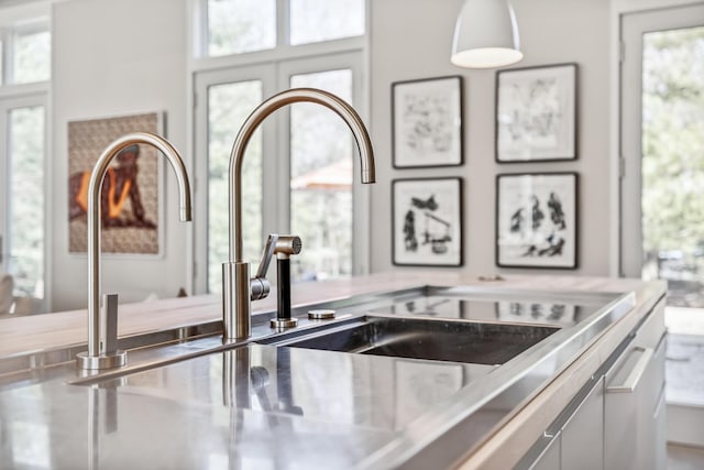 details with a sink and stainless steel counters