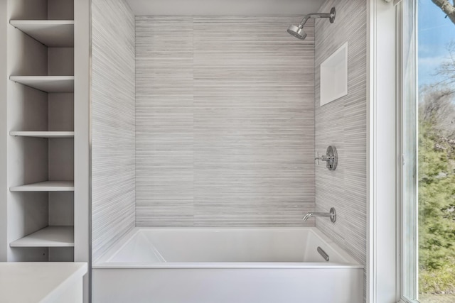 bathroom with shower / tub combination and built in features