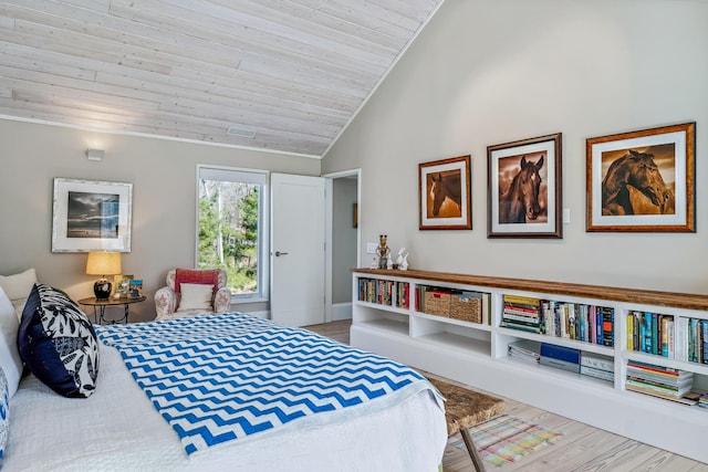 bedroom with wood finished floors, vaulted ceiling, and wooden ceiling
