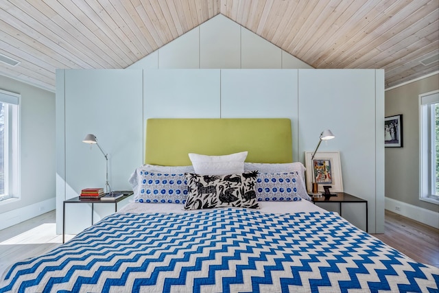 bedroom featuring wood ceiling, baseboards, vaulted ceiling, and wood finished floors