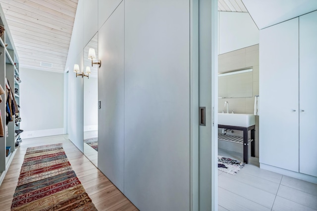 hallway featuring an inviting chandelier