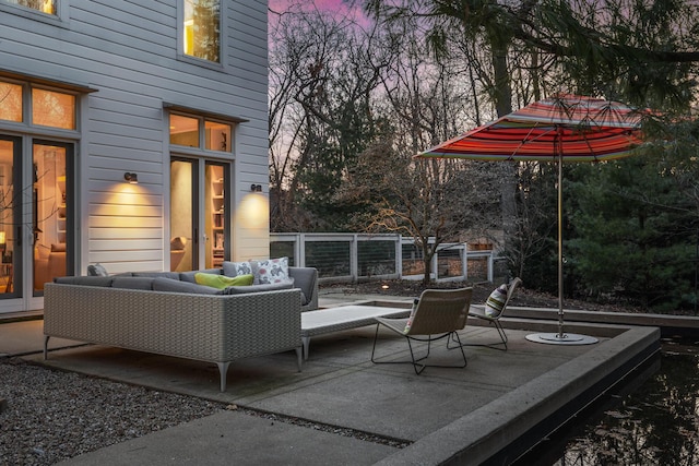 patio terrace at dusk with an outdoor living space