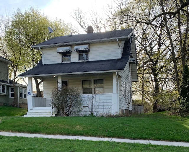 802 Dupont St, Flint, MI 48504 - view of front of property featuring a shingled roof, a front yard, and covered porch