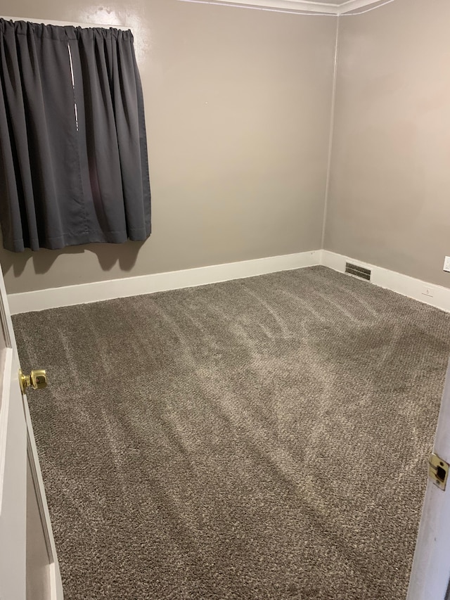 802 Dupont St, Flint, MI 48504 - empty room with carpet, visible vents, and baseboards