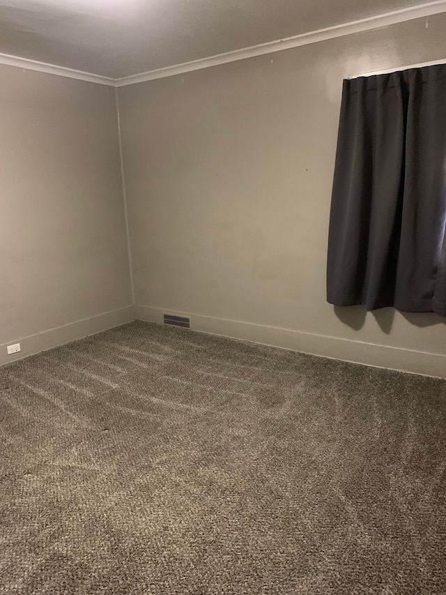 802 Dupont St, Flint, MI 48504 - carpeted empty room featuring baseboards, crown molding, and visible vents