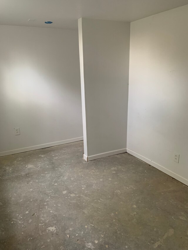 802 Dupont St, Flint, MI 48504 - empty room with concrete floors and baseboards
