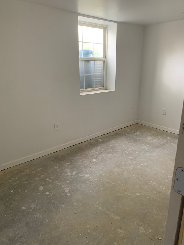 802 Dupont St, Flint, MI 48504 - spare room featuring concrete floors and baseboards