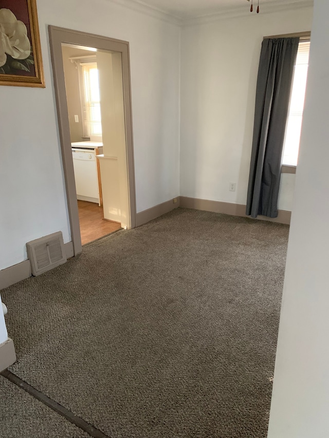 802 Dupont St, Flint, MI 48504 - unfurnished room featuring carpet floors, visible vents, and ornamental molding