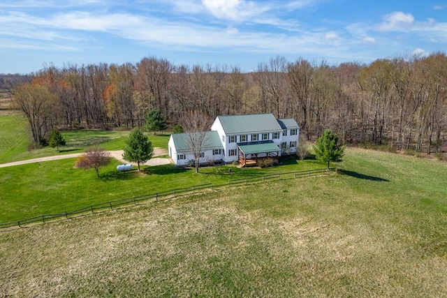 birds eye view of property featuring a wooded view