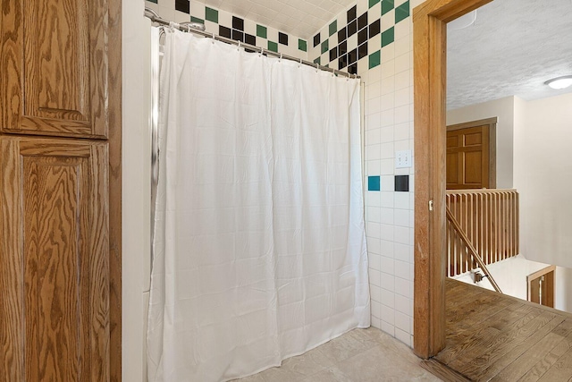 bathroom featuring a shower with curtain
