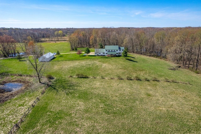 bird's eye view with a rural view and a view of trees