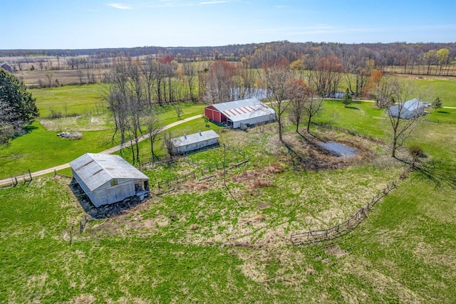 birds eye view of property with a rural view