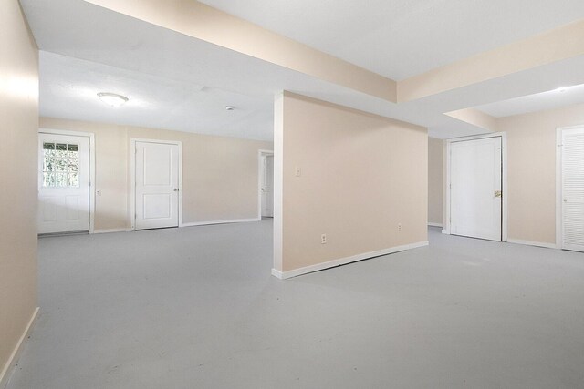spare room featuring baseboards