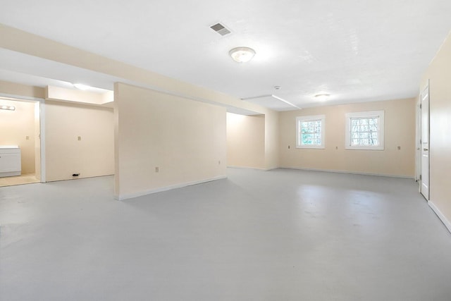 basement featuring visible vents and baseboards