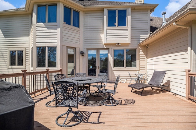 9037 Yorkshire Dr, Saline, MI 48176 - deck with french doors and outdoor dining area